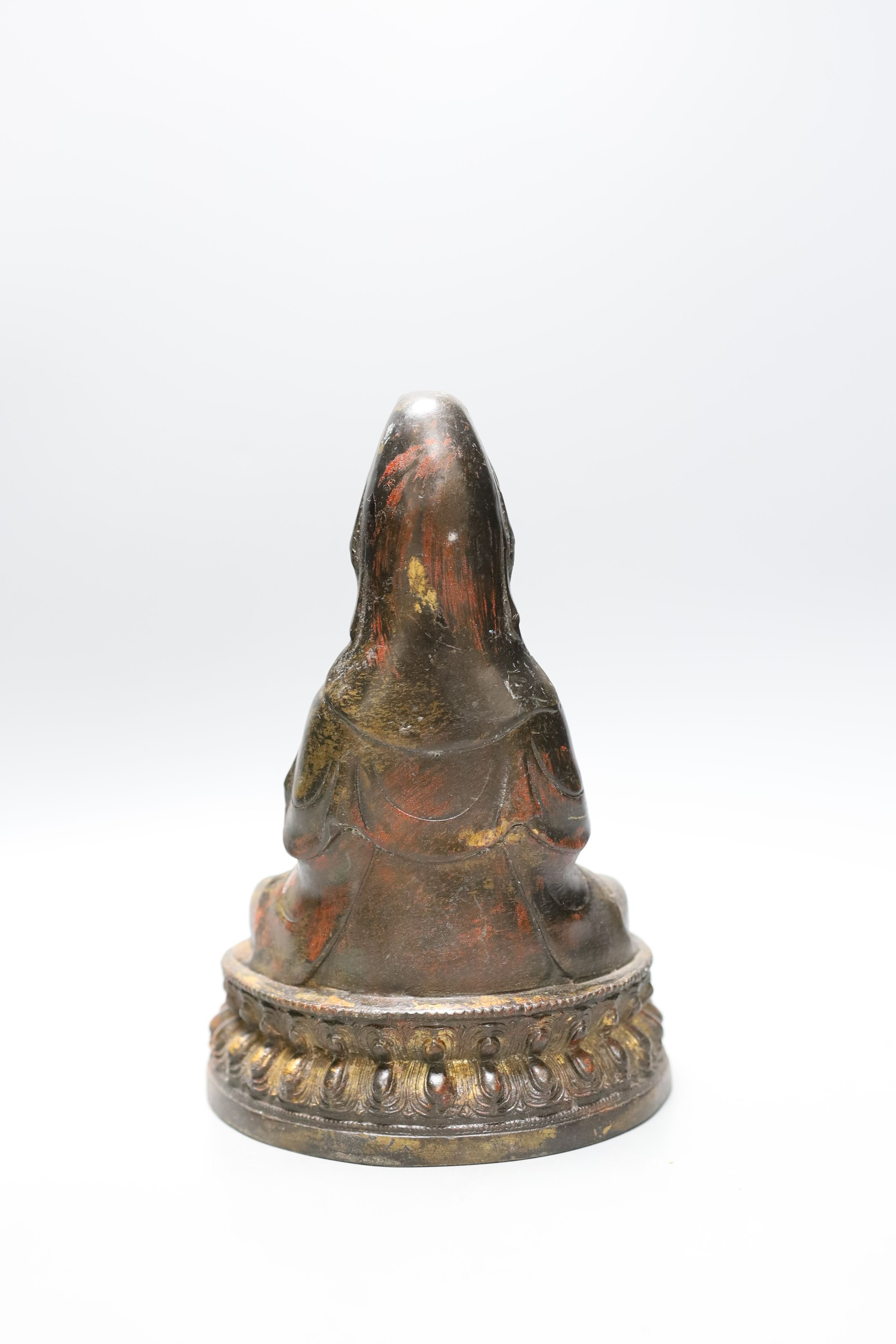 A Chinese iron alloy figure of Guanyin, 23cm tall, together with a Chinese Ding type bowl and a Chinese enamelled porcelain dish (3)